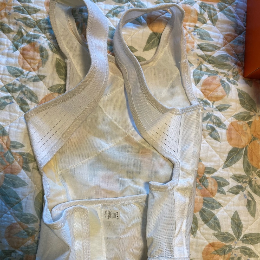 Ventilated dorsal vest for correcting posture. Worn one time.